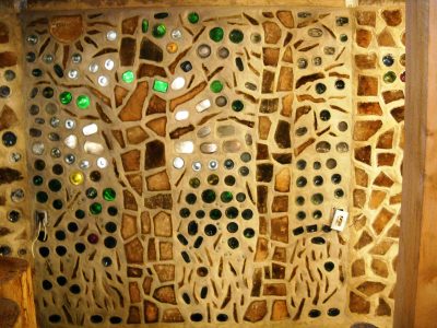 Two fine trees in a cordwood panel by someone whose contact we have lost. Please contact us! 