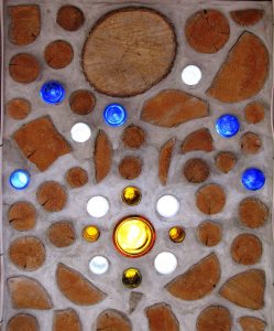 One of our cordwood students created this sunrise design on the east wall. Stars are going out as the sun rises.