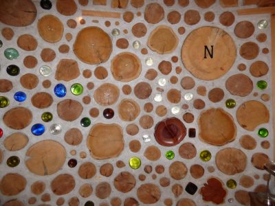 The two pointer stars of the Big Dipper, made of clear bottle-ends, point to Polaris, the North Star, extreme upper right,