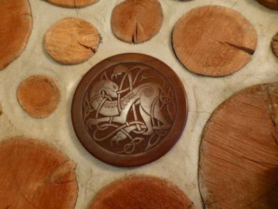 This walnut carving of a dragon from the Book of Kell is an inch thick, and is mounted on a shortened log-end of the same diameter.