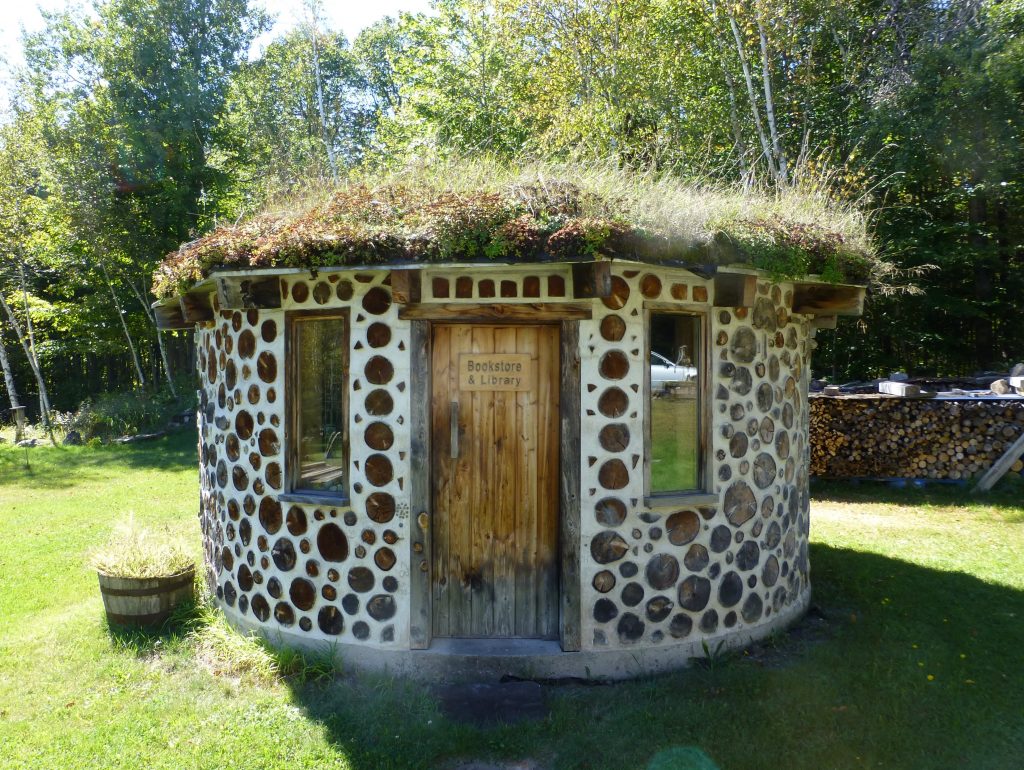 The Library and Book Store at Earthwood is 16-feet external diameter with 12-inch cordwood walls, 154 SF of actual usable space inside.